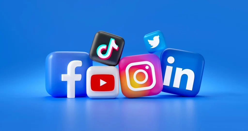 mariia-shalabaieva-HBkpnDVc_Ic-unsplash Stylised social media logos on a blue backgound