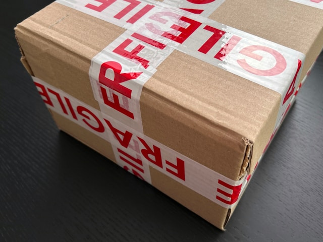 A parcel wrapped in fragile tape